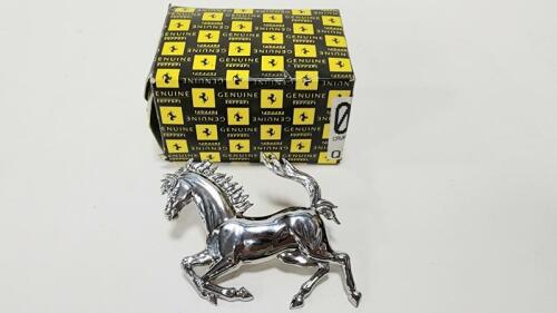 PRANCING HORSE: A NOS rear&nbsp;chromed pressed metal&nbsp;prancing horse in original box, 12cm long