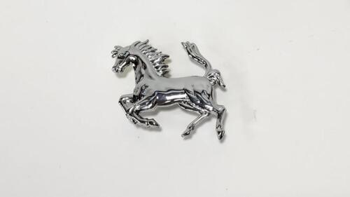 PRANCING HORSE: A NOS front chromed pressed metal&nbsp;prancing horse with short mounting studs, 8cm long