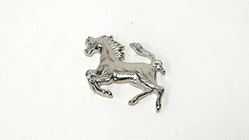 PRANCING HORSE: A NOS console mounted prancing horse, 3.5cm long