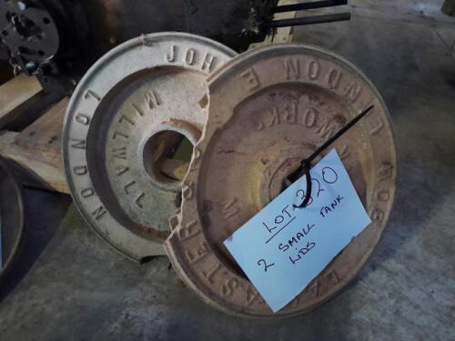 Two cast metal tank lids (small)