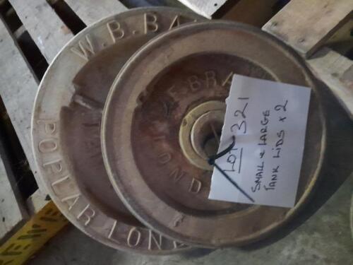 Two cast metal tank lids (small & large)