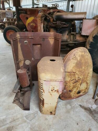 A collection of International W9 parts, fuel tank, cowling etc