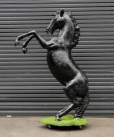 PRANCING HORSE: A life size black fibreglass prancing horse,&nbsp;