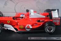 FERRARI: A 1:18 scale Hot Wheels Ferrari F2004 Formula 1 (B6201) race car as driven by Rubens Barrichello, racing number '2' with associated sponsorship decals; with original display box, model on display board. - 2