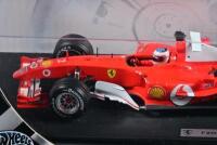 FERRARI: A 1:18 scale Hot Wheels Ferrari F2004 Formula 1 (B6201) race car as driven by Rubens Barrichello, racing number '2' with associated sponsorship decals; with original display box, model on display board. - 3