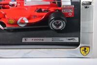 FERRARI: A 1:18 scale Hot Wheels Ferrari F2004 Formula 1 (B6201) race car as driven by Rubens Barrichello, racing number '2' with associated sponsorship decals; with original display box, model on display board. - 4