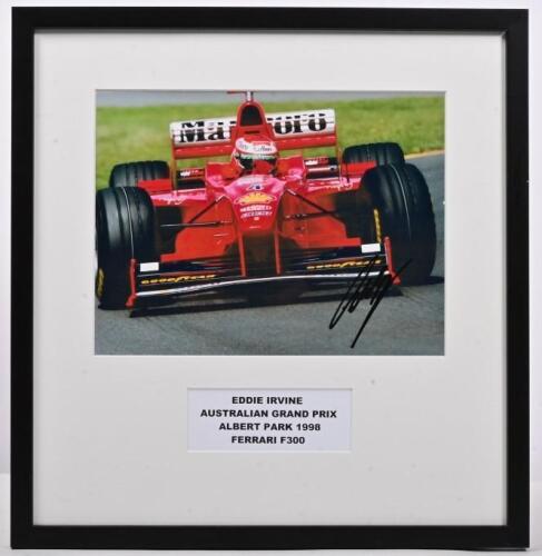 IRVINE: A colour picture of a Ferrari F300 as raced by Eddie Irvine at the AUSTRALIAN GRAND PRIX ALBERT PARK 1998. Picture signed by Eddie Irvine