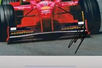 IRVINE: A colour picture of a Ferrari F300 as raced by Eddie Irvine at the AUSTRALIAN GRAND PRIX ALBERT PARK 1998. Picture signed by Eddie Irvine - 2