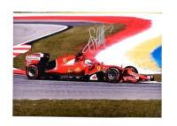 VETTEL: A colour picture of Sebastian Vettel racing a Ferrari SF15-T during the 2015 Formula 1 season. Picture signed by Sebastian Vettel