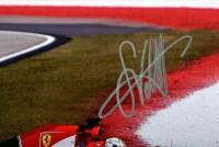 VETTEL: A colour picture of Sebastian Vettel racing a Ferrari SF15-T during the 2015 Formula 1 season. Picture signed by Sebastian Vettel - 2