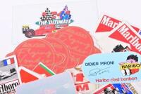 FORMULA 1 STICKERS: A large quantity of period Formula 1 stickers including 'AVIA Fittipaldi', 'HARIBO - DIDIER PIRONI','RACING ELF TEAM' - 2