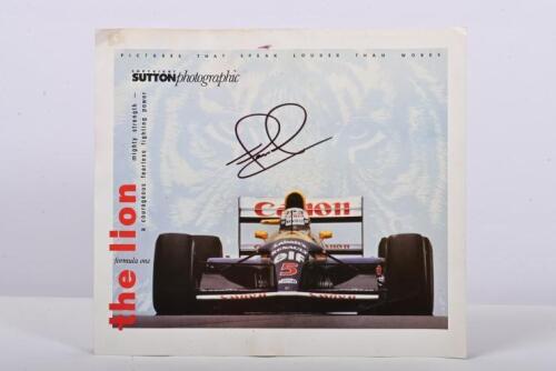 MANSELL: A colour picture by COPYRIGHT SUTTON photographic - 'the lion' - of Nigel Mansell racing a Williams FW14B. Picture signed by Nigel Mansell