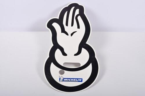 MICHELIN: A Michelin hand sign in the form of a Bibendum hand