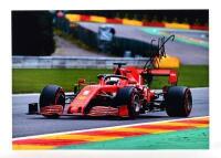 VETTEL: A colour picture of Sebastian Vettel racing a Ferrari SF1000. Sebastian Vettel signature