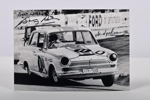 SETON/BOSWORTH: A black and white picture on photographic paper of Barry Seton and Midge Bosworth racing a Ford Cortina GT at the 1965 Armstrong 500. Bosworth & Seton signatures