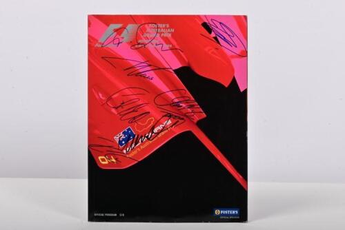 FORMULA 1: A March 2004 'FOSTER'S AUSTRALIAN GRAND PRIX' Official Program. Cover signed by various Formula 1 drivers including Fernando Alonso, Olivier Panis, Kimi Raikkonen, Mark Webber