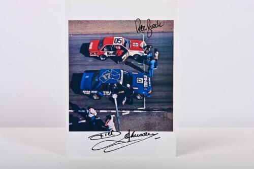 BROCK/JOHNSON: A colour picture of Peter Brock in a HDT VH Holden Commodore and Dick Johnson in XD Ford Falcon at a starting grid. Brock & Johnson signatures. Circa 1981