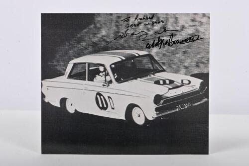 SETON/BOSWORTH: A black and white picture on photographic paper of Barry Seton and Midge Bosworth racing a Ford Cortina GT at the 1965 Armstrong 500. Bosworth & Seton signatures