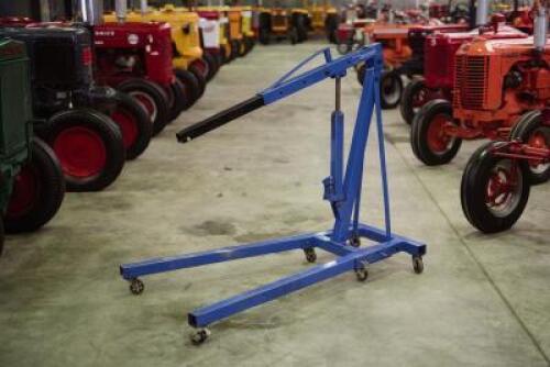 HOIST: A blue 'Trade Quip' foldable engine crane with 1,000KG lifting capacity.