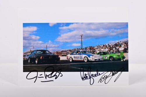 A.T.C.C: A colour picture of a starting grid from the A.T.C.C series. Picture depicts the JPS BMW 635csi of Jim Richards, HDT VK Holden Commodore of Peter Brock, Palmer Tube Mills Ford Mustang of Dick Johnson. Signed by all three drivers