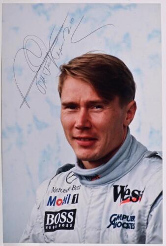 HAKKINEN: A colour driver profile picture of Mika Hakkinen. Hakkinen signature