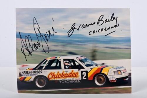 BAILEY/GRICE: A colour picture of Graeme Bailey and Allan Grice racing the Chickadee Holden VK Commodore to victory at the 1986 James Hardie 1000. Bailey & Grice signatures