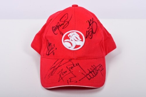HOLDEN: A red Holden cap signed by various Holden V8 Supercar and Supercar racing drivers. Rick and Todd Kelly, Craig Lowndes, Cameron McConville, Greg Murphy, Jim Richards signatures