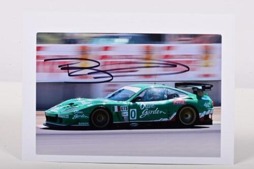 FERRARI: A colour picture of Bill Auberlen racing a Ferrari 550 GT (Olive Garden) at 2003 Leguna Seca. Bill Auberlen signature