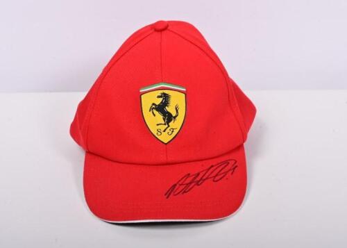 VETTEL: A red Scuderia Ferrari cap, visor signed by Sebastian Vettel