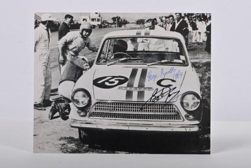 JANE/REYNOLDS: A black and white picture of Bob Jane and George Reynolds racing a Ford Cortina Mk.1 GT to victory at the 1964 Armstrong 500. Picture signed by Jane & Reynolds