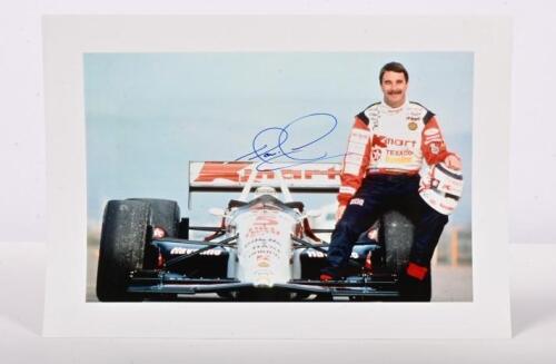 MANSELL: A colour picture of Nigel Mansell posing with the K-mart Newman/Haas Lola. Nigel Mansell signature
