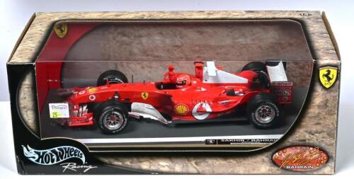 FERRARI: A 1:18 scale Hotwheels Ferrari F2004 Formula 1 (B6222) race car as driven by Michael Schumacher at SAKHIR/BAHRAIN 04/04/04. Limited Edition 10362/15,000