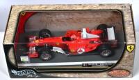 FERRARI: A 1:18 scale Hotwheels Ferrari F2004 Formula 1 (B6222) race car as driven by Michael Schumacher at SAKHIR/BAHRAIN 04/04/04. Limited Edition 10362/15,000 - 2