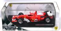 FERRARI SCHUMACHER: A 1:18 scale Hot Wheels Ferrari 248 F1 (J2980) as raced by Michael Schumacher, racing number '5' with associated 'vodafone' decals, with driver; original display box, model on black display board.