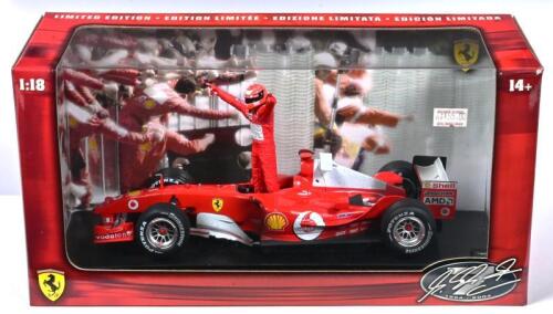 FERRARI: A 1:18 scale Hotwheels Racing Ferrari F2004 Formula 1 model (B6219). With Michael Schumacher figurine