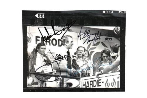 BATHURST 1977: An original Ian Smith black and white picture of Prime Minister Malcolm Fraser presenting the winners trophy to Jacky Ickx, Allan Moffat and Colin Bond at Bathurst 1977. Picture signed by the former Prime Minister Malcolm Fraser, Jacky Ickx