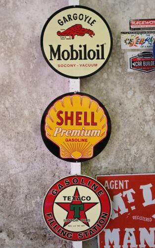 SIGNS: Three reproduction pressed tin oil advertising signs, diameter 27cm