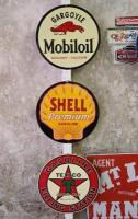 SIGNS: Three reproduction pressed tin oil advertising signs, diameter 27cm