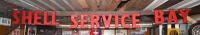 SHELL: An original "SHELL SERVICE BAY" perspex lettered sign, some damage, in three sections.
