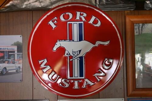 MUSTANG: A large reproduction embossed tin Ford Mustang sign, 59.5cm diameter, Ford licenced product.
