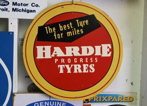 TYRE: A original mid century "The best tyre for miles, Hardie Progress Tyres" printed sign on masonite, marked lower right "AT16", 41.5cm diameter
