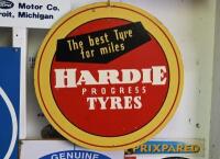 TYRE: A original mid century "The best tyre for miles, Hardie Progress Tyres" printed sign on masonite, marked lower right "AT16", 41.5cm diameter