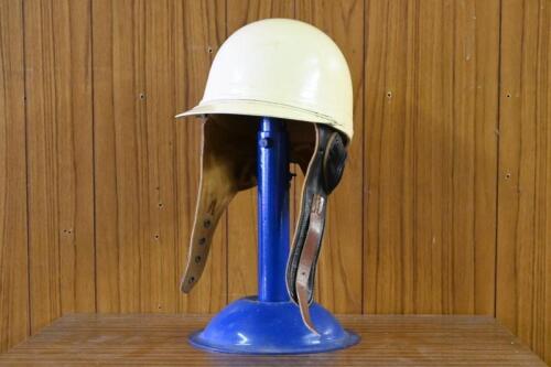 HELMET: A circa 1950s pudding form peaked helmet by Cromwell headwear, helmets limited, England, in good condition