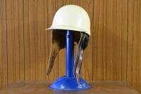 HELMET: A circa 1950s pudding form peaked helmet by Cromwell headwear, helmets limited, England, in good condition