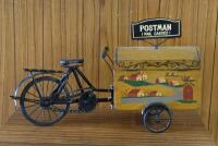 MAIL BOX: A modern novelty form box in the form of a postman mail carrier bicycle, 60cm long x 33cm high.