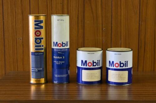 MOBIL: Two Mobil oil cylindrical tins and two one pound grease tins