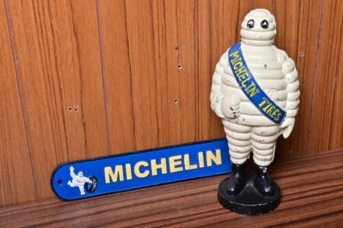 MICHELIN: Two reproduction cast iron Michelin items including a Bibendum money box, 25cm high
