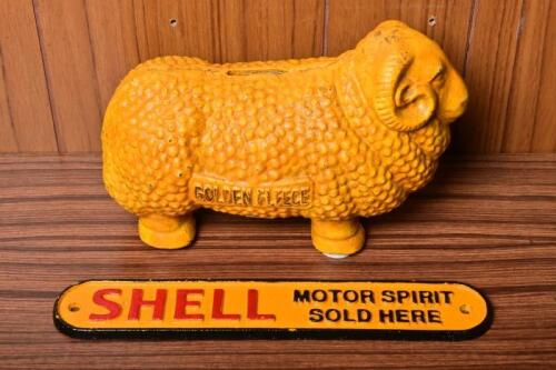 GOLDEN FLEECE/SHELL: Two cast iron reproduction items including a Golden Fleece ram money box, 16cm high x 25cm wide