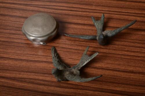 MASCOT: Two Swallow bird mascots and early radiator cap
