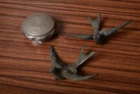MASCOT: Two Swallow bird mascots and early radiator cap